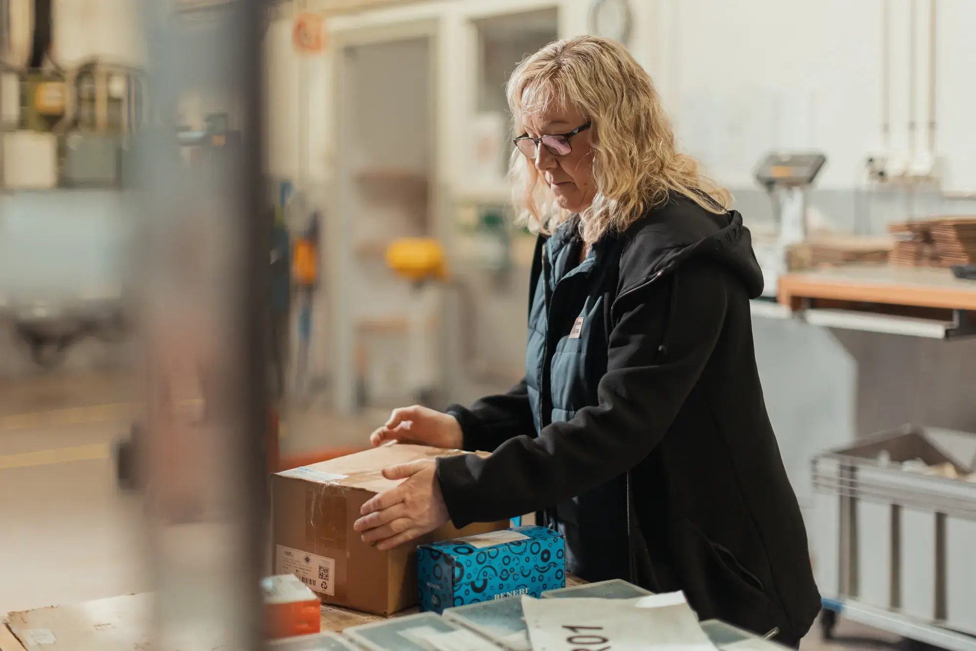 A woman packs products